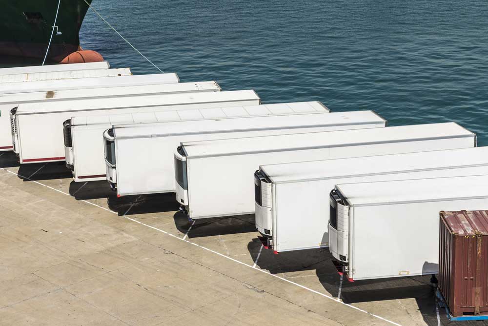 refrigerated ocean freight containers waiting at port